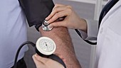 Doctor taking blood pressure