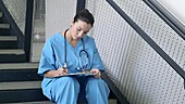 Female doctor on staircase