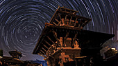Star trails over temple, timelapse