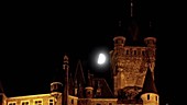 Moon over German castle, timelapse
