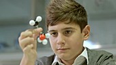 School boy working in laboratory