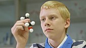 School boy working in laboratory