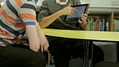 Schoolboys using tablet