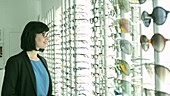Woman choosing glasses