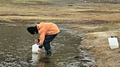 Scientist collecting water samples