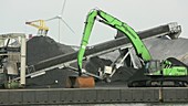 Wind turbines next to coal facility