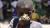 Boy eating fruit