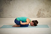 Child's pose with deep stomach breathing (detox yoga)