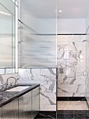 Elegant marble bathroom with shower area