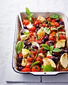 Oven-baked tomatoes and olives with feta cheese