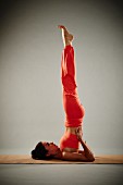 Shoulder stand (Sarvangasana) – Step 2: stretch your legs up and create a straight line