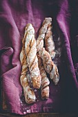 Wurzelbrot (Swiss twisted bread) on a purple cloth