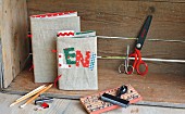 Hand-made linen book covers with name in fabric lettering