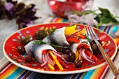 Marinated herring with peppers and olives