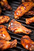 Glazed chicken wings on a grill
