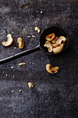 Roasted cashew nuts on a spoon