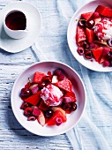 Watermelon fruit salad with ice-cream and raspberry-pepper syrup