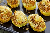 Stuff baked potatoes topped with cheese