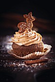 A gingerbread cupcake with cinnamon & cream cheese frosting