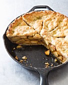 Apple cake baked in a cast iron pan (sliced)