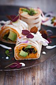 Burritos with avocado, sweet potatoes and red onions