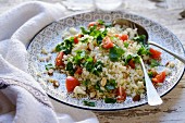 Cauliflower tabbouleh with almonds, cherry tomatoes and parsley