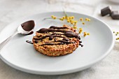 An oat biscuit drizzled with chocolate