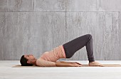 Bridging (pilates) – Step 1: lie on back, raise buttocks