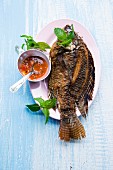 A whole fried fish with chilli sauce, Thailand