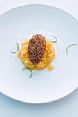 A baked chocolate egg on passion fruit and whiskey granita