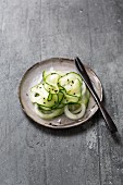 Pickled cucumbers with onions and black sesame seeds