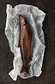 Smoked trout on a sheet of paper