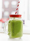 A green smoothie made with avocado and spinach
