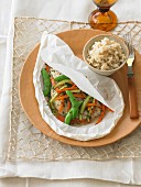 Steamed catfish with vegetables in parchment paper