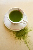 Matcha tea in a cup and as powder