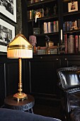 Antique table lamp in library