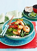 Sweet and spicy prawns with green beans on rice (Vietnam)