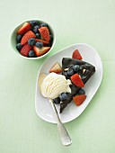 Hazelnut cake with fresh berries and vanilla ice cream