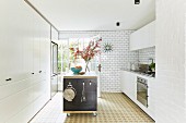 Mobile kitchen island with shelves in white kitchen