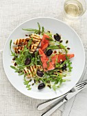 Rocket salad with grilled cheese, watermelon and olives