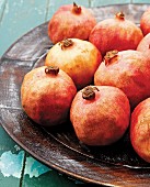 Several pomegranates on a plate
