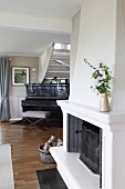 Fireplace and piano in traditional living room