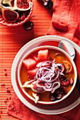 Tomato soup with figs, cherries and red onions