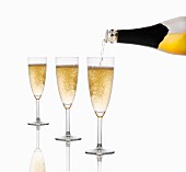 Sparkling wine being poured into glasses