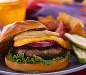 A portobello burger with cheese and red onions