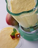A mango smoothie in a blender