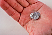 A piece a Gallium melting in the hand