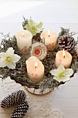 Vintage Advent wreath with numered candles and hellebore flowers