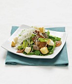 Caesar salad with crispy bacon and grated cheese