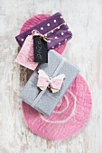 Wrapped gifts decorated with hand-made gift tags on felt mats